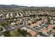 High-angle shot of a meticulously planned community with varying architectural styles and mature trees at 10 Staghorn St, Henderson, NV 89012