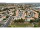 Expansive aerial view of a well-planned community with lush landscaping and diverse home styles at 10 Staghorn St, Henderson, NV 89012
