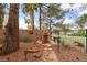 Beautiful backyard with a stone waterfall feature and mature landscaping at 10 Staghorn St, Henderson, NV 89012