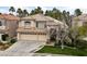 Attractive two-story home featuring a 3-car garage and landscaped front yard at 10 Staghorn St, Henderson, NV 89012