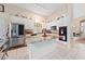 Well-lit kitchen with white cabinetry, stainless steel appliances, a large island, and adjacent dining space at 10 Staghorn St, Henderson, NV 89012