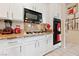 Modern kitchen featuring white cabinetry, granite countertops, and stainless steel appliances at 10 Staghorn St, Henderson, NV 89012