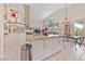 Kitchen with an island that connects to a dining area and staircase leading to the second floor at 10 Staghorn St, Henderson, NV 89012