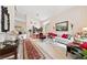 Open-concept living room featuring ample seating and views into the dining area at 10 Staghorn St, Henderson, NV 89012