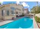Spacious backyard with a sparkling pool and spa, ideal for relaxation and outdoor entertaining at 10500 Pacific Palisades Ave, Las Vegas, NV 89144