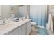 Bright bathroom with double vanity, modern fixtures, and a shower-tub combo at 10500 Pacific Palisades Ave, Las Vegas, NV 89144