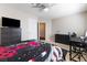 Spacious bedroom with dark furniture, providing ample storage and work space at 10500 Pacific Palisades Ave, Las Vegas, NV 89144