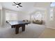Open game room featuring neutral carpet and ping pong table under vaulted ceilings at 10500 Pacific Palisades Ave, Las Vegas, NV 89144