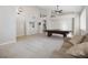Open game room with vaulted ceilings, neutral carpet and ping pong table at 10500 Pacific Palisades Ave, Las Vegas, NV 89144