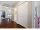 Bright hallway featuring hardwood floors, a closet, and access to other rooms in the home at 10500 Pacific Palisades Ave, Las Vegas, NV 89144