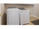 Well-equipped laundry room with modern, white washer and dryer units at 10500 Pacific Palisades Ave, Las Vegas, NV 89144