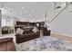 Spacious living room features an open floor plan leading to the kitchen and a staircase at 10500 Pacific Palisades Ave, Las Vegas, NV 89144