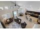 Open-concept living area showcasing a pool view, a dining area, a modern kitchen, and comfortable seating at 10500 Pacific Palisades Ave, Las Vegas, NV 89144