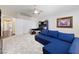 Comfortable living area with plush sofa, neutral decor, and a ceiling fan at 10500 Pacific Palisades Ave, Las Vegas, NV 89144
