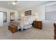 Bright and airy bedroom featuring a large window and classic furniture at 10500 Pacific Palisades Ave, Las Vegas, NV 89144