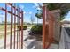 Open gate with a view of the community park and green space at 10500 Pacific Palisades Ave, Las Vegas, NV 89144