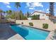 Backyard pool featuring a pristine pool, a soothing spa, and mature landscaping at 10500 Pacific Palisades Ave, Las Vegas, NV 89144