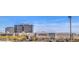 Cityscape featuring Macy's retail building in Summerlin with city buildings and mountains, ideal for retail experiences at 11178 Corsica Mist Ave, Las Vegas, NV 89135