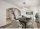 Inviting dining room with a dark table and seating for six people at 11178 Corsica Mist Ave, Las Vegas, NV 89135