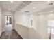 Bright hallway with elegant lighting fixture and neutral walls and carpet at 11178 Corsica Mist Ave, Las Vegas, NV 89135