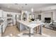 Spacious open kitchen and living area with a large center island at 11178 Corsica Mist Ave, Las Vegas, NV 89135