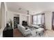 Cozy living room featuring modern lighting, neutral decor, and an entertainment area at 11178 Corsica Mist Ave, Las Vegas, NV 89135