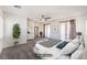 Bright main bedroom with neutral decor, large windows, and balcony access at 11178 Corsica Mist Ave, Las Vegas, NV 89135