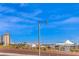 View of the surrounding neighborhood featuring commercial buildings, and mountain views at 11178 Corsica Mist Ave, Las Vegas, NV 89135