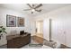 Comfortable office with ample workspace, neutral color palette, and a ceiling fan at 11178 Corsica Mist Ave, Las Vegas, NV 89135