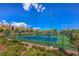 Community tennis courts surrounded by green landscaping, perfect for active lifestyles and sports enthusiasts at 11178 Corsica Mist Ave, Las Vegas, NV 89135