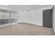 A bright, unfurnished room with a sliding door, featuring neutral carpet and ample natural light at 1390 Vegas Valley Dr # 26, Las Vegas, NV 89169