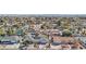 Wide aerial shot of a residential area with diverse homes, palm trees, and mountain views at 1912 Parkchester Dr, Las Vegas, NV 89108