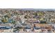Aerial view of home in residential area, with attached garage, solar panels, and well-manicured landscaping; house marker added at 1912 Parkchester Dr, Las Vegas, NV 89108