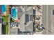 Aerial shot of backyard featuring a pool, solar panels, several parked cars and a manicured lawn, showcasing outdoor amenities at 1912 Parkchester Dr, Las Vegas, NV 89108
