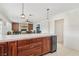 Spacious kitchen with island seating, stainless appliances, and open layout at 1912 Parkchester Dr, Las Vegas, NV 89108