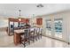 Open kitchen with a central island, stainless steel appliances, and access to backyard pool at 1912 Parkchester Dr, Las Vegas, NV 89108