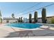 Inviting backyard pool with diving board, slide, and well-manicured landscaping at 1912 Parkchester Dr, Las Vegas, NV 89108
