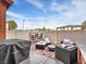 Relaxing backyard featuring outdoor seating, Blackstone grill, and well-maintained landscaping at 2005 Via Firenze, Henderson, NV 89044