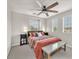 Cozy bedroom featuring a ceiling fan, natural light, and neutral decor at 2005 Via Firenze, Henderson, NV 89044