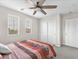 Bright bedroom featuring a ceiling fan, neutral decor, and natural light at 2005 Via Firenze, Henderson, NV 89044