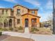 Charming two-story home featuring a stone facade and cozy front porch, perfect for relaxing at 2005 Via Firenze, Henderson, NV 89044