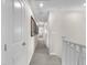 Upstairs hallway with white walls, carpeted floor, and doors leading to rooms at 2005 Via Firenze, Henderson, NV 89044