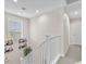 Upstairs hallway with a view of the stairwell and a window at 2005 Via Firenze, Henderson, NV 89044