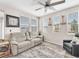 Cozy living room with neutral colors, lots of natural light, and comfortable seating at 2005 Via Firenze, Henderson, NV 89044
