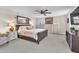 Spacious main bedroom with ceiling fan, carpet flooring and ensuite bathroom access at 2005 Via Firenze, Henderson, NV 89044