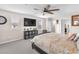 Large main bedroom with ceiling fan, carpet and plenty of natural light from the windows at 2005 Via Firenze, Henderson, NV 89044