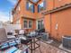 Outdoor patio with comfortable seating, brick pavers, and view of the home's exterior at 2005 Via Firenze, Henderson, NV 89044