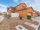 Townhome featuring a small patio, privacy fence, and a two-car garage for convenient parking at 2005 Via Firenze, Henderson, NV 89044