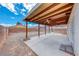 Backyard featuring a covered patio, block wall fencing, and gravel landscaping at 2029 Rose Coral Ave, Las Vegas, NV 89106