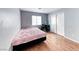 Bedroom with wood flooring, window for natural light, and closet for storage at 2029 Rose Coral Ave, Las Vegas, NV 89106